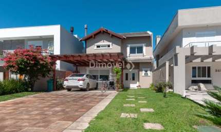 Casa em condomínio fechado com 3 quartos à venda na Avenida Juca Batista, 8000, Belém Novo, Porto Alegre por R$ 1.280.000