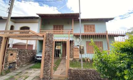 Casa com 4 quartos à venda na Rua Mário Assumpção, 15, Guarujá, Porto Alegre por R$ 750.000