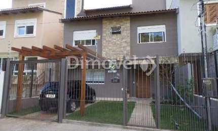 Casa com 3 quartos à venda na Rua Henrique Anawate, 590, Guarujá, Porto Alegre por R$ 850.000