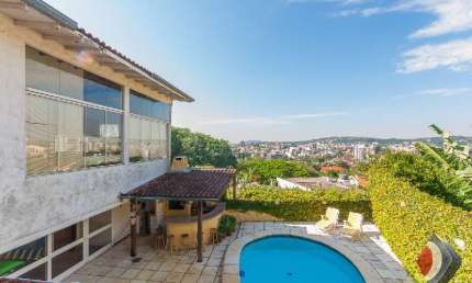 Casa com 5 quartos à venda na Rua Coroados, 526, Vila Assunção, Porto Alegre por R$ 1.280.000