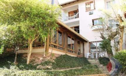 Casa com 3 quartos à venda na Rua Edgar Luiz Schneider, 55, Jardim Isabel, Porto Alegre por R$ 900.000