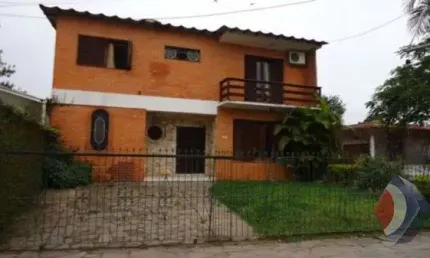 Casa com 3 quartos à venda na Rua Jacundá, 670, Guarujá, Porto Alegre por R$ 570.000