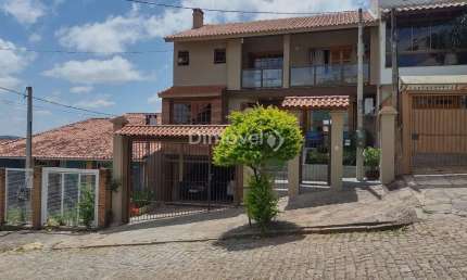 Casa com 3 quartos à venda na Rua Inês Vinhas, 45, Espírito Santo, Porto Alegre por R$ 1.090.000