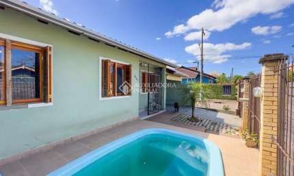 Casa com 3 quartos à venda na Rua Corujas, Jardim Algarve, Alvorada
