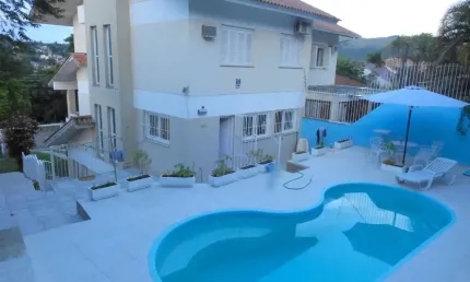 Casa com 3 quartos à venda na Rua Professor Antônio José Remião, 263, Espírito Santo, Porto Alegre por R$ 950.000