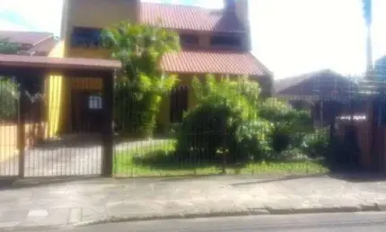 Casa em condomínio fechado com 4 quartos à venda na Rua Fernando Ferrari, 449, Piratini, Sapucaia do Sul por R$ 750.000