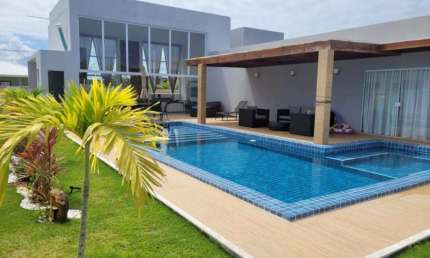 Casa em condomínio fechado com 4 quartos à venda na RUA MANOEL LEAL, Barra do Jacuípe, Camaçari por R$ 1.230.000