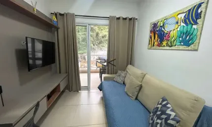 APARTAMENTO PRAIA GRANDE com 2 dormitórios sendo 1 suíte,1 vaga de garagem,varanda gourmet com churrasqueira,sala 2 ambientes