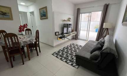 APARTAMENTO PRAIA GRANDE com 2 dormitórios sendo 1 suíte,1 vaga de garagem,varanda gourmet com churrasqueira,sala 2 ambientes