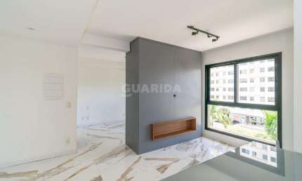 Apartamento semimobiliado com 1 dormitório e 1 vaga de garagem no bairro Central Park