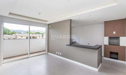 Apartamento com 1 dormitório e 1 vaga de garagem no bairro Partenon
