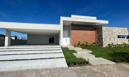 CASA EM CONDOMÍNIO FECHADO - 4 SUÍTES - 4 VAGAS - À 10 MINUTOS DA PRAIA - ÁREA DE LAZER