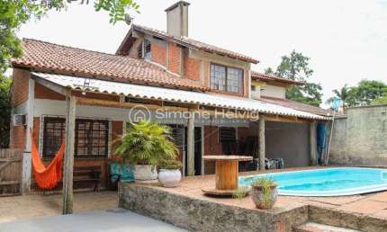 Casa com 3 quartos à venda na Avenida Assis Brasil, 260, Flórida, Guaíba por R$ 590.000