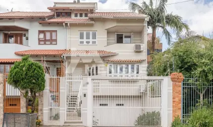 Casa com 3 quartos à venda na rua professor isidoro la porta, 112, jardim planalto, porto alegre por r$ 1.600.000