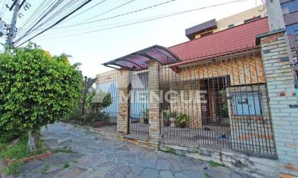 Casa com 5 quartos à venda na Rua Umbú, 566, Passo da Areia, Porto Alegre por R$ 1.500.000