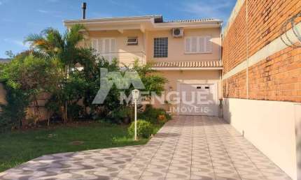 Casa em condomínio fechado com 4 quartos à venda na Rua Tapirapés, 184, Sarandi, Porto Alegre por R$ 1.063.829
