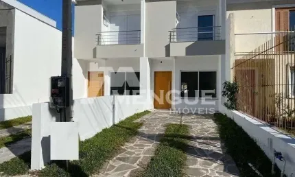 Casa com 3 quartos à venda na Rua Itacyr Rossi, 190, Guarujá, Porto Alegre por R$ 499.000