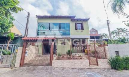 Casa com 4 quartos à venda na Rua Bento Rosa, 242, Sarandi, Porto Alegre por R$ 749.000