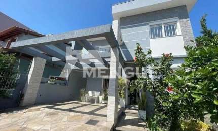 Casa com 3 quartos à venda na Rua Théo Benevenuto, 195, Ecoville, Porto Alegre por R$ 980.000