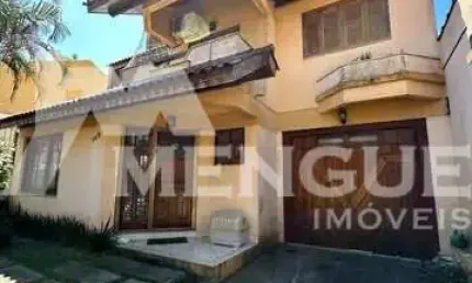 Casa com 3 quartos à venda na rua josé carlos de souza lobo, 142, parque santa fé, porto alegre por r$ 630.000