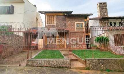 Casa com 3 quartos à venda na Rua Vicente Marsiglia Filho, 206, Alto Petrópolis, Porto Alegre por R$ 655.000