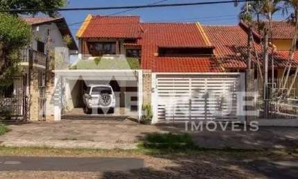 Casa com 4 quartos à venda na Rua Doutor Paulino Guerra, 575, Jardim Itu Sabará, Porto Alegre por R$ 1.298.000