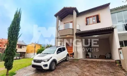 Casa em condomínio fechado com 3 quartos à venda na Rua Deputado Hugo Mardini, 1780, Passo das Pedras, Porto Alegre por R$ 680.000