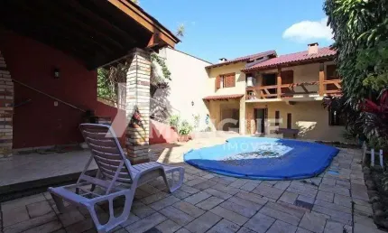 Casa com 3 quartos à venda na Rua Francisca Lechner, 343, Parque Santa Fé, Porto Alegre por R$ 650.000