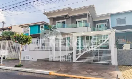 Casa em condomínio fechado com 4 quartos à venda na Rua Walter Porto Filho, 70, Mário Quintana, Porto Alegre por R$ 1.250.000