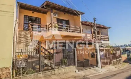 Casa com 5 quartos à venda na Rua Waldomiro Silveira Dias, 40, Jardim Itu Sabará, Porto Alegre por R$ 449.000