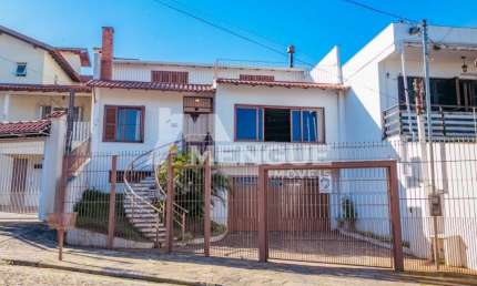 Casa com 4 quartos à venda na Rua General Sady Cahen Fischer, 55, Parque Santa Fé, Porto Alegre por R$ 1.400.000