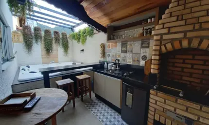 Sobrado com 3 dormitórios à venda, 175 m² por R$ 1.360.000,00 - Canto do Forte - Praia Grande/SP
