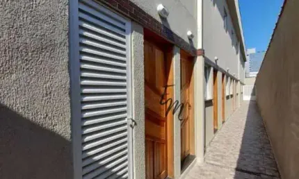 Casa sobreposta alta com sacada, 64 m² por R$ 230.000 - Jardim Glória - Praia Grande/SP