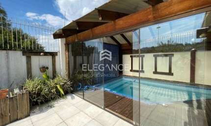 Elegance imóveis vende casa com 325m 4 dormitórios 2 suítes, piscina aquecida salão com churrasqueira e 3 vagas de garagem/box. Comprar R$1.890.000,00