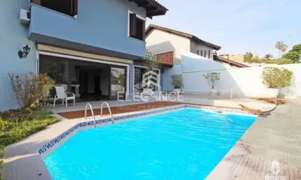 Elegance imóveis vende casa de 430m, 4 dormitórios, 3 suítes, living, piscina churrasqueira, adega e 8 vagas de garagem/box. Comprar R$ 2.400.000,00