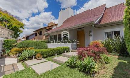 Elegance Imóveis vende ampla casa de 476m² privativos, 4 suítes, 4 vagas, piscina, jardim, segurança no Bairro Chácara das Pedras Porto Alegre