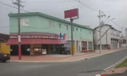 Excelente prédio comercial na Praia Grande/SP, com 659 m² a.u., composto de 6 lojas e 4 aptos. Prox. Rua Maria Beltrame Borloni (REF 19.966)