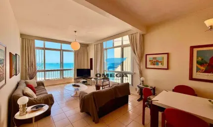 Apartamento frente mar á venda na praia das Pitangueiras no Guarujá I Omega Imoveis