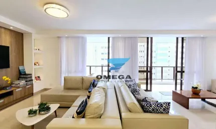 Apartamento reformado à venda na praia das Pitangueiras no Guarujá I Omega Imoveis