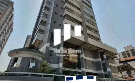 Apartamento em praia grande com 3 dormitórios, 2 vagas de garagem e sacada.