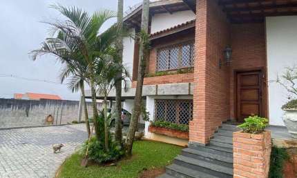 Casa com 4 dormitórios para alugar, 329 m² por R$ 16.388,32/mês - Parque do Colégio - Suzano/SP