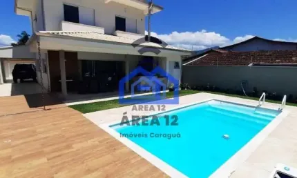 Linda casa à venda no Jardim Britânia - 4 dormitórios, sendo 2 suítes, banheiro, sala com 2 ambient