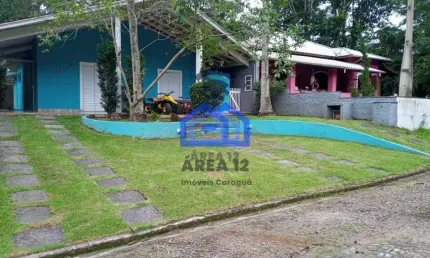 Casa à venda em Condomínio no bairro do Massaguaçu - 3 dormitórios, sendo 1 suíte, 4 banheiros, sal