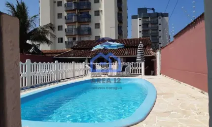 Casa à venda no bairro Martim de Sá - 3 dormitórios com ar condicionado, 3 banheiros, cozinha, área