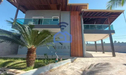 Lindíssimo sobrado com piscina e vista para o mar à venda no bairro Praia das Palmeiras em Caraguat