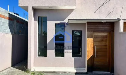 Casa à venda no Loteamento Estância Mirante de Caraguatatuba, SP - Acabamento moderno com 03 dormit
