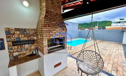 Casa ampla com 3 dormitórios à venda no bairro Estrela d'Alva, área central de Caraguatatuba - Exce