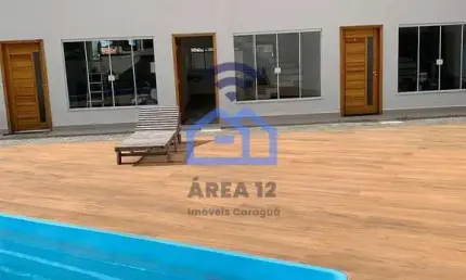 Sobrado Novo à venda em condomínio com piscina, a apenas 300m da praia do Massaguaçu em Caraguatatu