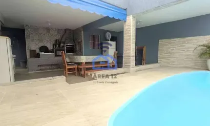 Casa com piscina e área gourmet à venda no bairro do indaiá em caraguatatuba, sp