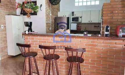Sobrado com piscina e área gourmet à venda no bairro da Praia das Palmeiras em Caraguatatuba, SP